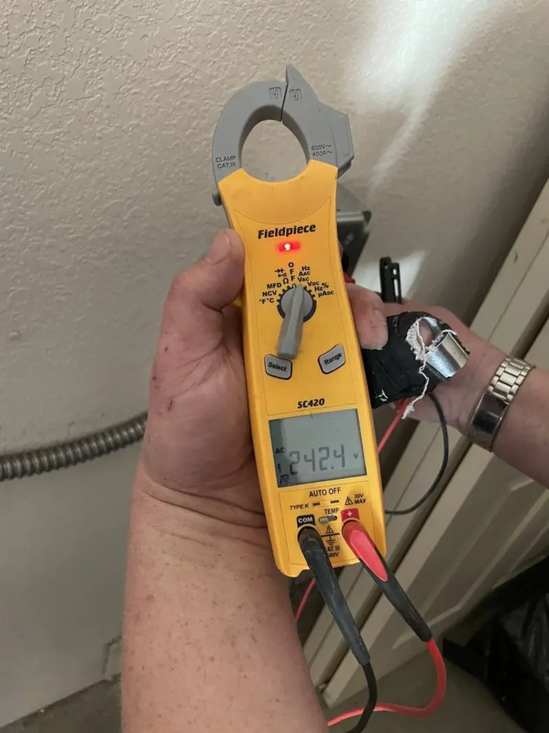 Voltage testing with clamp meter during Whole House Surge Protector in Orting